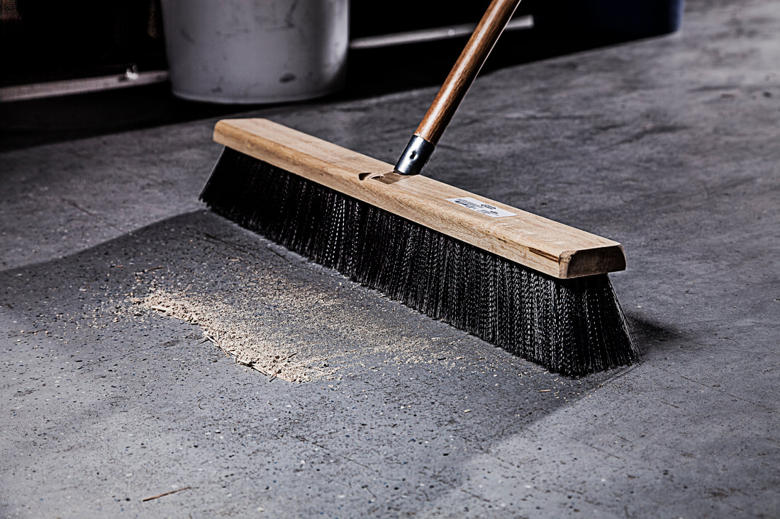 Broom sweeping floor
