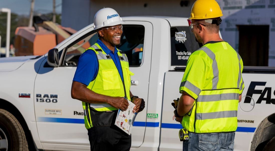 Construction worker & Fastenal employee on jobsite delivery