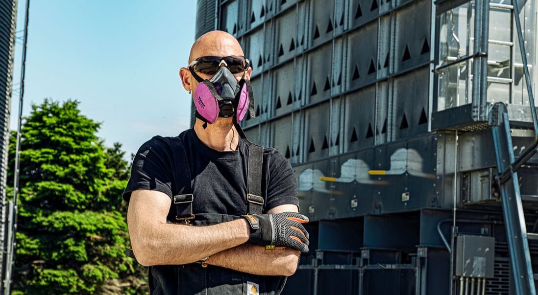 Man standing with respirator on