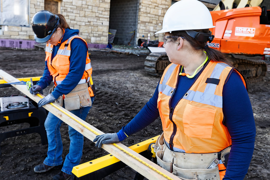 Two women construction workers on a jobsite