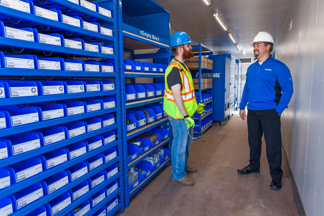 Jobsite worker and Fastenal rep having conversation in a POD