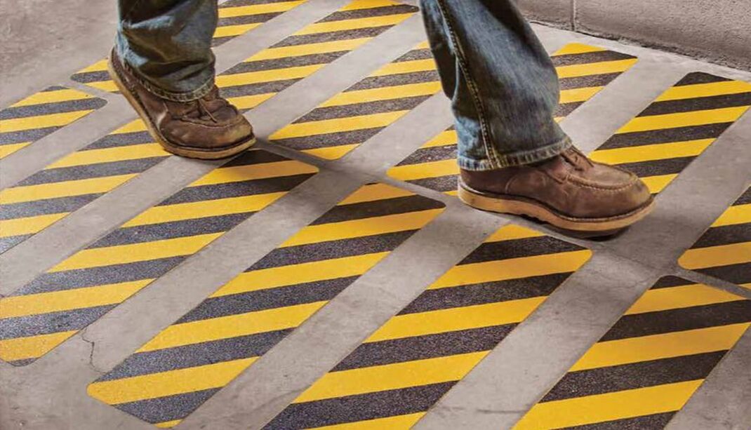Employee walking on floor tape