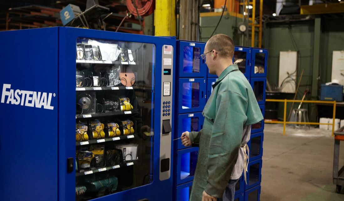 Person standing at industrial vending machine